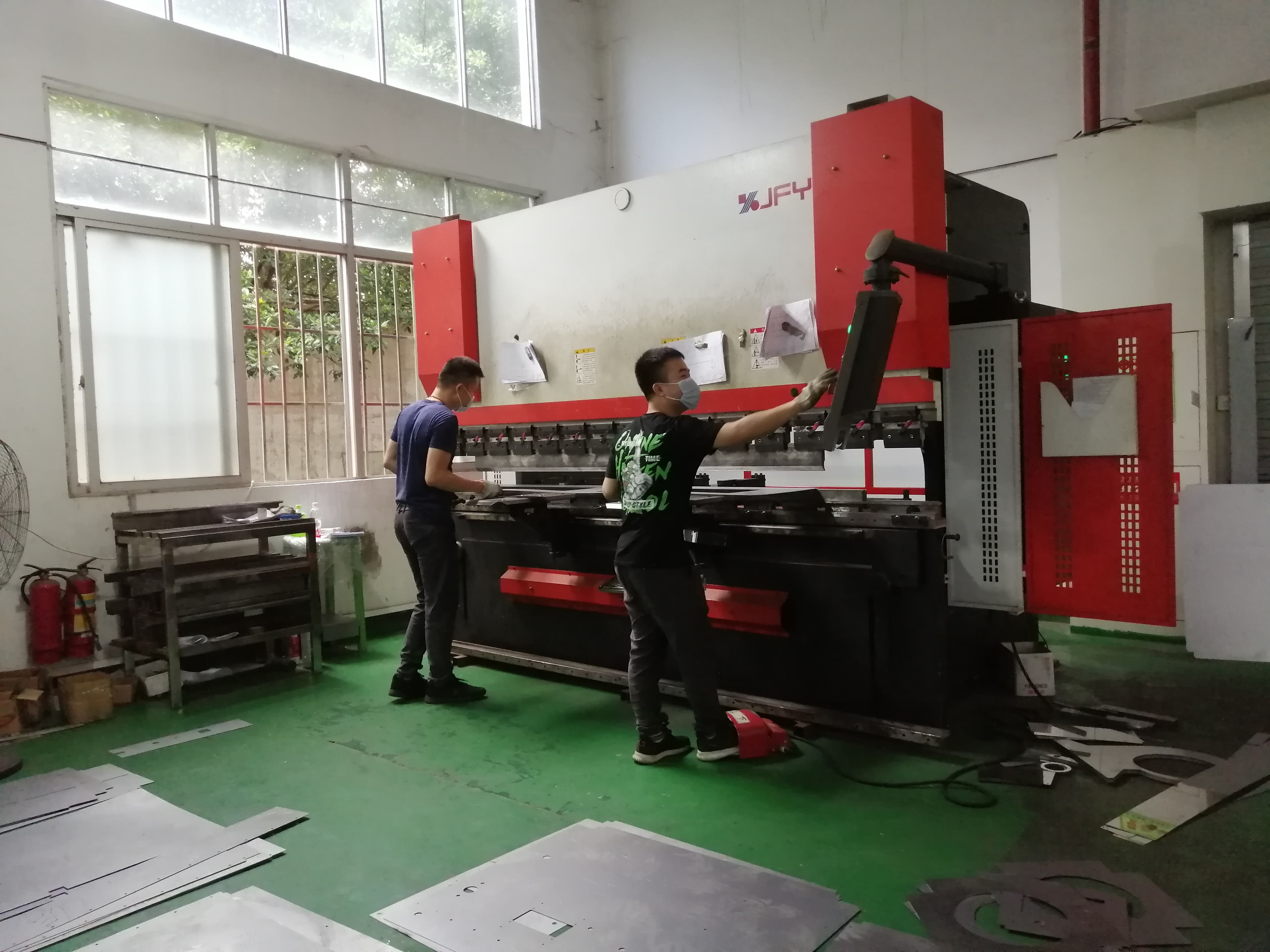 Zhengkai staff working at sheet-metal fabrication equipment